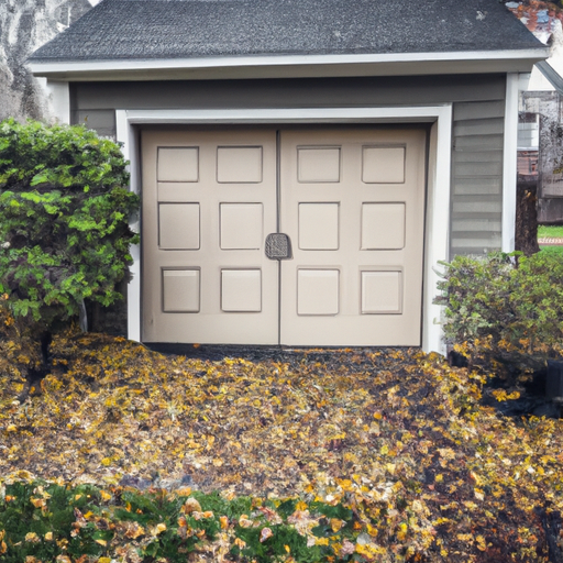 Suburban Ridgewood home exterior with a closed garage door, wet leaves on driveway, and trimmed hedges in soft autumn light.